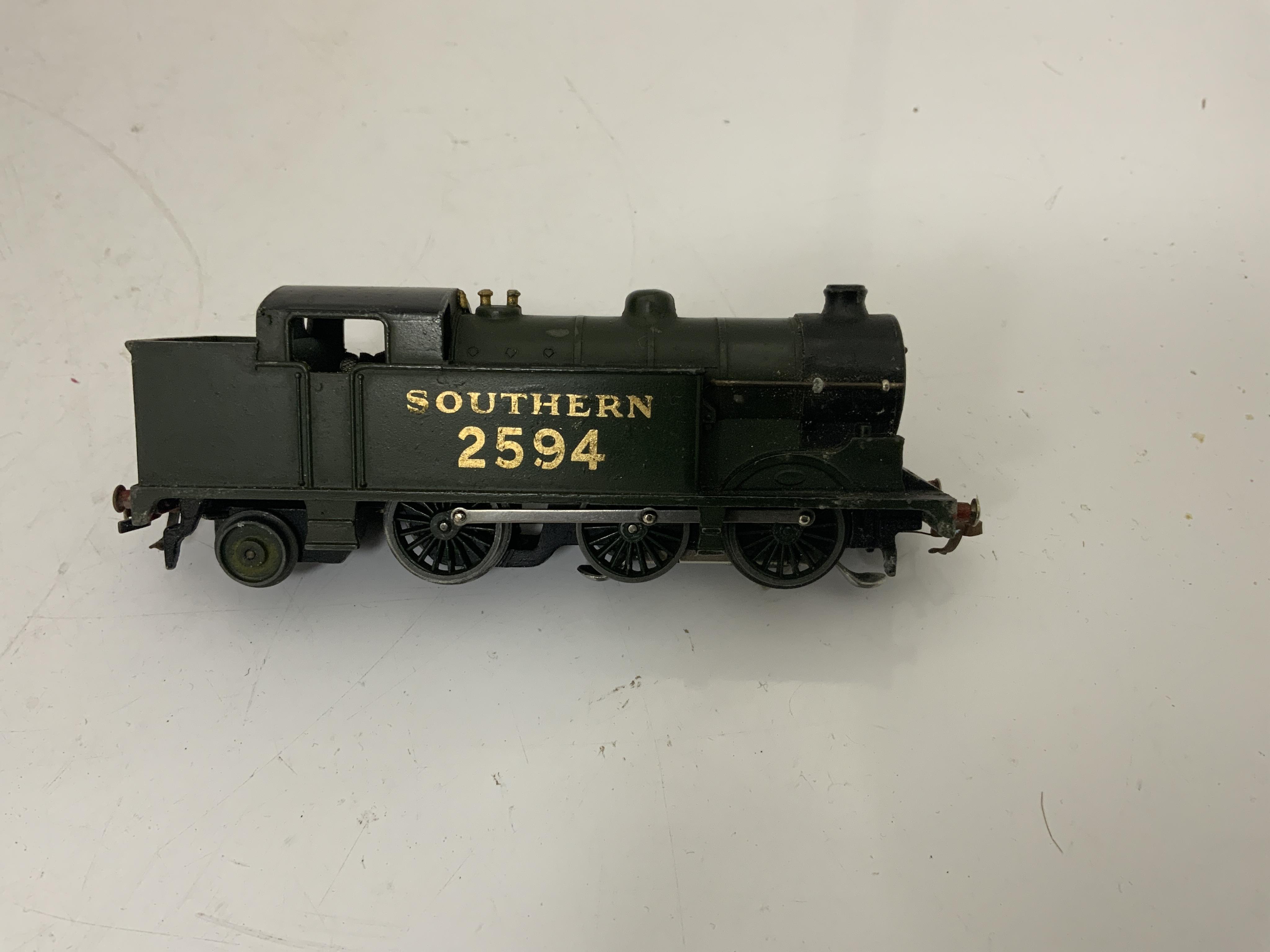 A boxed Hornby Dublo EDG7 Southern Railway Tank Goods Set, comprising of an SR Class N2 0-6-2T locomotive, 2594, for 3-rail running, two Southern freight wagons and an associated LMS open wagon, track sections, etc.